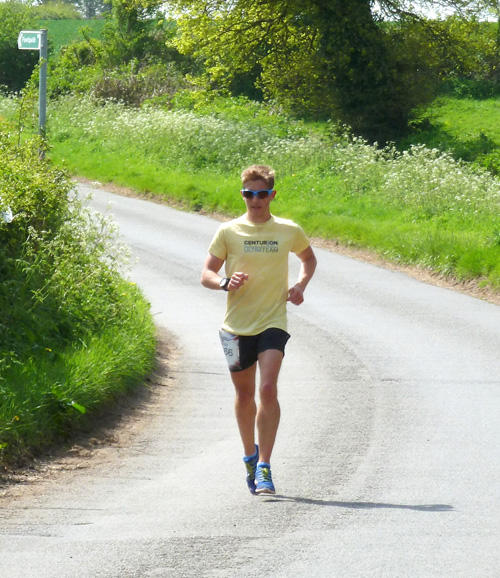 The second runner to pass through the village. Photo: Peter Mackness
