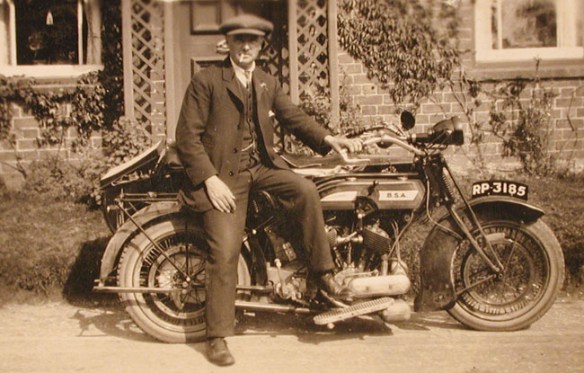 Wisteria Cottage owner Cecil Walton outside the house with his motor cycle and side-car in the late 1920s or early 1930s